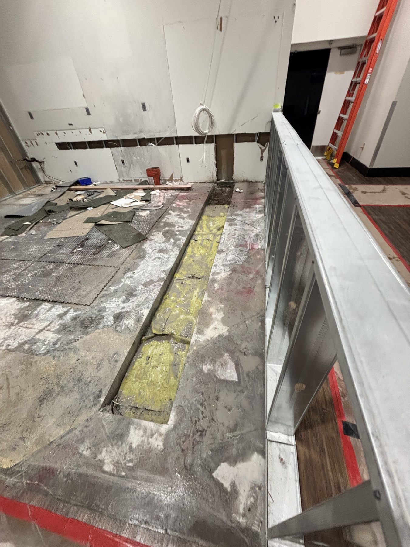 Saw-cut trench in an interior concrete slab during a renovation